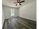 Bright bedroom with ceiling fan and vinyl plank flooring at 1 Pine Trace Trl, Ocala, FL 34472