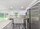 Modern kitchen with white cabinets and stainless steel appliances at 1 Pine Trace Trl, Ocala, FL 34472