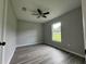 Spacious bedroom with vinyl plank flooring and a large window at 7530 Sw 100Th St, Ocala, FL 34476