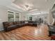 Open living room showcasing a sectional sofa and hardwood floors at 11831 Sw Highway 484, Dunnellon, FL 34432