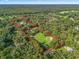 Aerial view showcasing the property's long lot and wooded surroundings at 11831 Sw Highway 484, Dunnellon, FL 34432