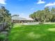 Spacious backyard with a refreshing pool and a view of the house at 11831 Sw Highway 484, Dunnellon, FL 34432