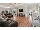 Relaxing living room with hardwood floors and leather furniture at 11831 Sw Highway 484, Dunnellon, FL 34432