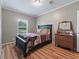 Cozy bedroom with a queen-size bed and wooden dresser at 11831 Sw Highway 484, Dunnellon, FL 34432