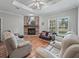 Cozy living room featuring a stone fireplace and comfortable seating at 11831 Sw Highway 484, Dunnellon, FL 34432