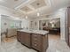 Kitchen island with granite countertop, offering extra prep space and storage at 11831 Sw Highway 484, Dunnellon, FL 34432