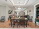 Bright dining room featuring a farmhouse table and chairs at 11831 Sw Highway 484, Dunnellon, FL 34432