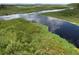 Aerial view of a tranquil river and lush wetlands at 11965 Sw 229Th Ave, Dunnellon, FL 34431