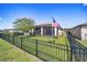 Backyard view showcasing a screened patio, and a well-manicured lawn at 9793 Sw 63Rd Loop, Ocala, FL 34481