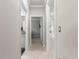Clean hallway with tile floors and access to bathroom and bedrooms at 9793 Sw 63Rd Loop, Ocala, FL 34481