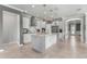 Modern kitchen with white cabinets, granite island, and stainless steel appliances at 9793 Sw 63Rd Loop, Ocala, FL 34481