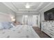 Spacious main bedroom with a dresser, nightstand, and large bed at 9793 Sw 63Rd Loop, Ocala, FL 34481
