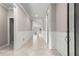 Elegant hallway with tile floors and white wainscoting at 9793 Sw 63Rd Loop, Ocala, FL 34481