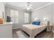 Comfortable bedroom with a queen bed and plenty of natural light at 9793 Sw 63Rd Loop, Ocala, FL 34481