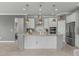 Spacious kitchen boasts granite countertops, stainless steel appliances, and a large island at 9793 Sw 63Rd Loop, Ocala, FL 34481