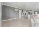 Open dining room with chandelier and view of kitchen at 9793 Sw 63Rd Loop, Ocala, FL 34481