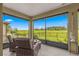 Screened lanai with seating area and a view of the backyard at 9793 Sw 63Rd Loop, Ocala, FL 34481