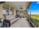 Spacious covered lanai with seating and tranquil backyard view at 9793 Sw 63Rd Loop, Ocala, FL 34481