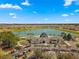 Aerial view of clubhouse and lake in Del Webb community at 9793 Sw 63Rd Loop, Ocala, FL 34481