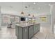 Open concept kitchen with large island, granite countertops and breakfast bar at 9793 Sw 63Rd Loop, Ocala, FL 34481