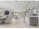 Open floor plan with large kitchen island and modern appliances at 9793 Sw 63Rd Loop, Ocala, FL 34481