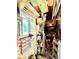 Storage area with shelving and gardening tools at 1779 Ne 12Th St, Ocala, FL 34470