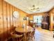 Dining area with wood paneling and wood table at 1779 Ne 12Th St, Ocala, FL 34470