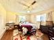 Bedroom with hardwood floors and a cozy atmosphere at 1779 Ne 12Th St, Ocala, FL 34470