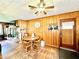 Cozy dining area with wood-paneled walls and a stone fireplace at 1779 Ne 12Th St, Ocala, FL 34470