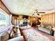 Spacious living area with fireplace and wood walls at 1779 Ne 12Th St, Ocala, FL 34470