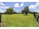 Spacious backyard with lush lawn and a view of the property at 7137 & 7141 S Magnolia Ave, Ocala, FL 34476