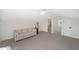 Spacious bonus room with a sofa and bathroom access at 7137 & 7141 S Magnolia Ave, Ocala, FL 34476