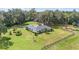Aerial view of a single story home with large green lawn and barn at 7137 & 7141 S Magnolia Ave, Ocala, FL 34476