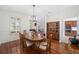 Formal dining room with hardwood floors and wooden dining set at 7137 & 7141 S Magnolia Ave, Ocala, FL 34476