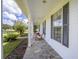 Inviting front porch with rocking chairs and a stone patio at 7137 & 7141 S Magnolia Ave, Ocala, FL 34476