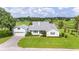 House exterior with attached garage and green lawn at 7137 & 7141 S Magnolia Ave, Ocala, FL 34476