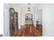 Bright entryway with hardwood floors and antique cabinet at 7137 & 7141 S Magnolia Ave, Ocala, FL 34476