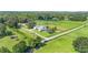 Aerial view of the house and surrounding land with pastures and trees at 7137 & 7141 S Magnolia Ave, Ocala, FL 34476