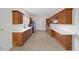 Well-equipped kitchen with wood cabinets and granite countertops at 7137 & 7141 S Magnolia Ave, Ocala, FL 34476