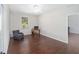 Bright home office with hardwood floors, a comfortable chair, and a work desk at 7137 & 7141 S Magnolia Ave, Ocala, FL 34476