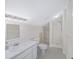 Bright bathroom featuring a shower and toilet at 7137 & 7141 S Magnolia Ave, Ocala, FL 34476