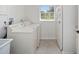 Convenient laundry room with washer, dryer, and extra storage at 7137 & 7141 S Magnolia Ave, Ocala, FL 34476