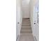 Carpeted staircase leading to the second floor at 7137 & 7141 S Magnolia Ave, Ocala, FL 34476