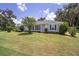 Ranch style house with a lush green lawn at 7137 & 7141 S Magnolia Ave, Ocala, FL 34476