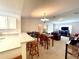 Dining area with table and chairs, open to living room at 892 Nash Loop, The Villages, FL 32162