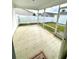 Screened porch with concrete flooring at 892 Nash Loop, The Villages, FL 32162