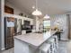 Modern kitchen with stainless steel appliances and an island with seating at 1436 Ne 161St Pl, Citra, FL 32113