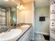 Modern bathroom with dual sinks and plenty of counter space at 1436 Ne 161St Pl, Citra, FL 32113