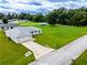 Single-story house with a large backyard and a long driveway at 1436 Ne 161St Pl, Citra, FL 32113