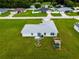 Single-story home with a backyard, pool, and playground at 1436 Ne 161St Pl, Citra, FL 32113